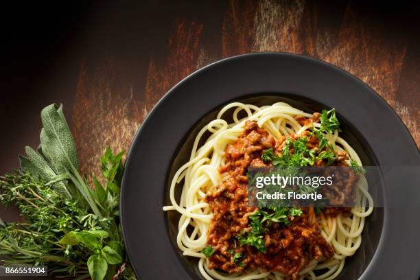 italian food: spaghetti bolognese still life - bouquet garni stock pictures, royalty-free photos & images
