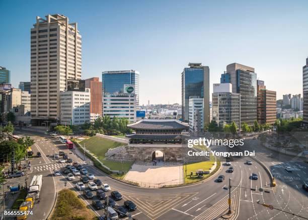 namdaemun gate and modern skyscrapers - namdaemun gate stock pictures, royalty-free photos & images