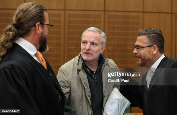 Daniel M. With his lawyers Robert Kain and Thomas Koblenzer arrives for his trial on charges of spying for the Swiss government, on October 26, 2017...