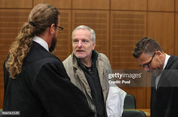 Daniel M. Shakes hand with his lawyers Robert Kain and Thomas Koblenzer as he arrives for his trial on charges of spying for the Swiss government, on...