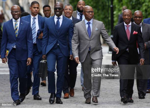 Finance Minister Malusi Gigaba is flanked on his right by treasury director-general Dondo Mogajane and on his left by his deputy Sfiso Buthelezi and...