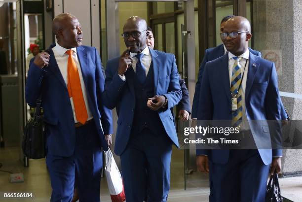 Finance Minister Malusi Gigaba is flanked on his right by Reserve Bank Governor Lesetja Kganyago and on his right by treasury director-general Dondo...