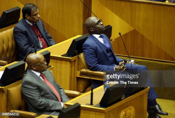 Finance Minister Malusi Gigaba is seen next to President Jacob Zuma during his Medium-term budget speech in Parliament on October 25, 2017 in Cape...