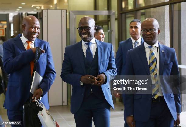 Finance Minister Malusi Gigaba is flanked on his right by Reserve Bank Governor Lesetja Kganyago and on his right by treasury director-general Dondo...