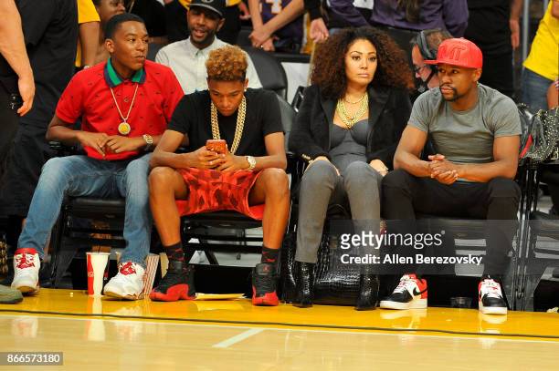 Boxer Floyd Mayweather, Jr. And his kids Zion Mayweather and Koraun Mayweather attend a basketball game between the Los Angeles Lakers and the...