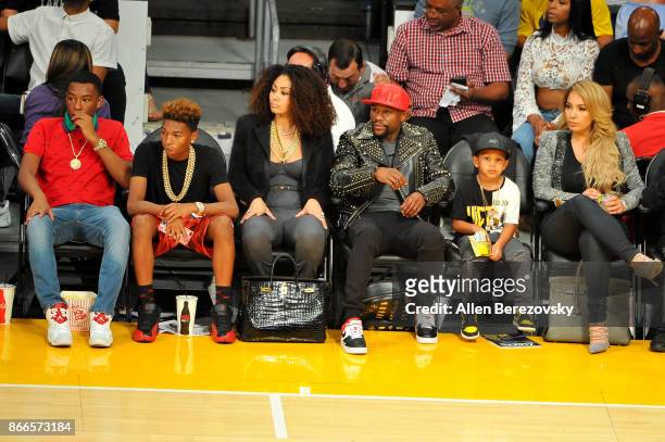 Boxer Floyd Mayweather, Jr. And his kids Zion Mayweather and Koraun Mayweather attend a basketball game between the Los Angeles Lakers and the...