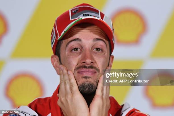 Ducati Team's Italian rider Andrea Dovizioso reacts during a press conference ahead of the Malaysia MotoGP at the Sepang International circuit in...