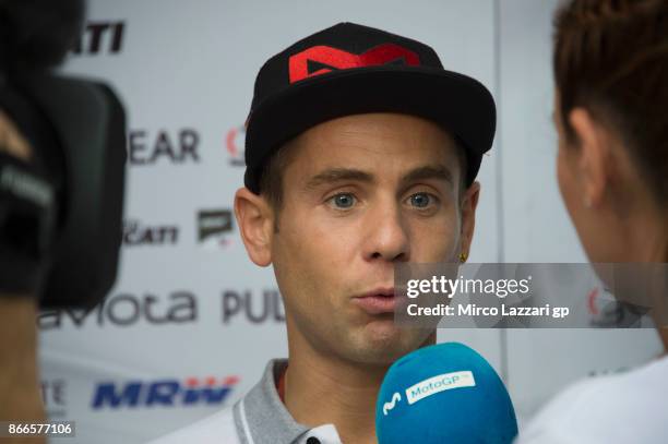 Alvaro Bautista of Spain and Pull&Bear Aspar Team speaks with journalists in paddock ahead of the MotoGP of Malaysia at Sepang Circuit on October 26,...