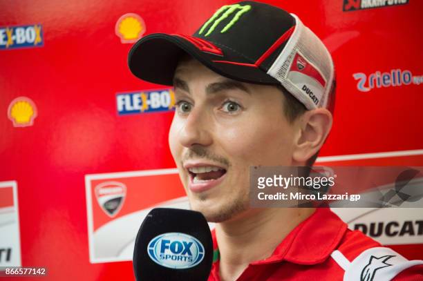 Jorge Lorenzo of Spain and Ducati Team speaks with journalists in paddock ahead of the MotoGP of Malaysia at Sepang Circuit on October 26, 2017 in...