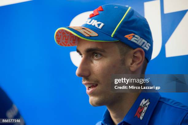 Alex Rins of Spain and Team Suzuki ECSTAR speaks with journalists in paddock ahead of the MotoGP of Malaysia at Sepang Circuit on October 26, 2017 in...