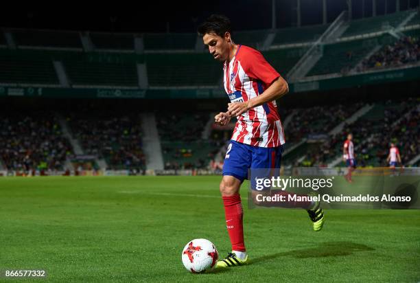 Nico Gaitan of Atletico de Madrid runs with the ball during the Copa del Rey first leg match between Elche CF and Atletico de Madrid at Estadio...