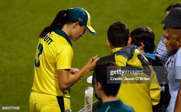 Australia's Megan Schutt signs autographs during the Women's One Day International match between Australia and England on October 26, 2017 in Coffs...