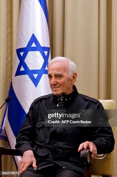 French-Armenian singer Charles Aznavour attends a ceremony on October 26, 2017 at the presidential compound in Jerusalem. Aznavour was presented with...