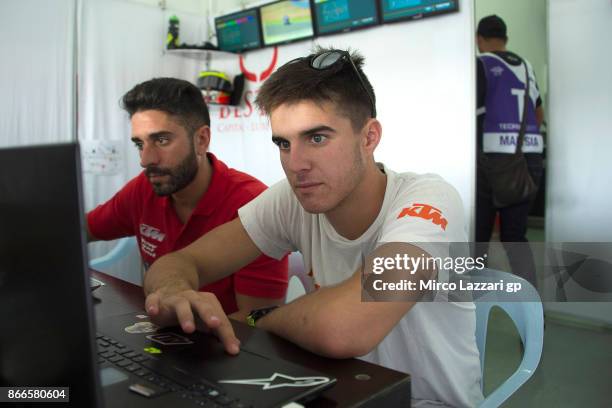 Marcos Ramirez of Spain and Platinum Bay Real Estate with a mechanic ahead of the MotoGP of Malaysia at Sepang Circuit on October 26, 2017 in Kuala...