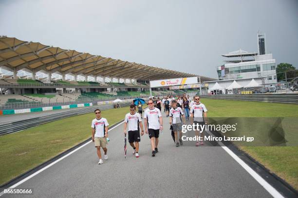 The MotoGp family pay a tribute to Marco Simoncelli's during the "Track walk to Turn 11 for SIC " ahead of the MotoGP of Malaysia at Sepang Circuit...