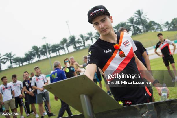 Lorenzo Balbassarri of Italy and Forward Racing Team pray during the "Track walk to Turn 11 for SIC " ahead of the MotoGP of Malaysia at Sepang...