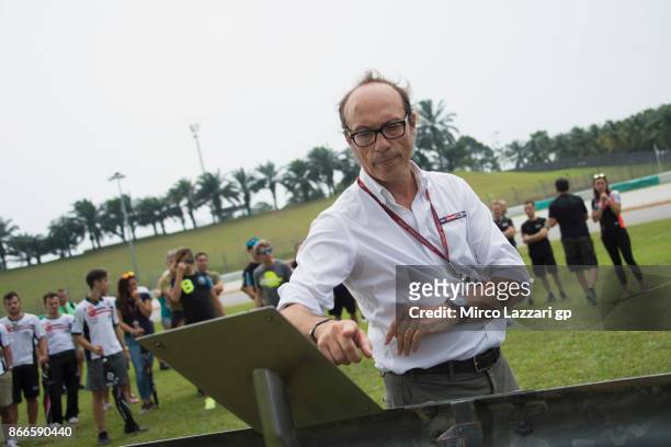 Guido Meda of Italy pray during the "Track walk to Turn 11 for SIC " ahead of the MotoGP of Malaysia at Sepang Circuit on October 26, 2017 in Kuala...