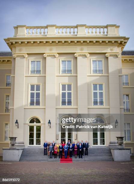 King Willem-Alexander and Prime Minister Mark Rutte present the new cabinet on the stairs of Palace Noordeinde on October 24, 2017 in The Hague,...