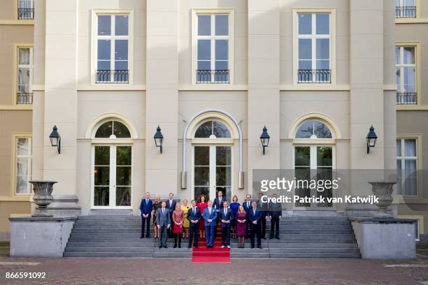 King Willem-Alexander and Prime Minister Mark Rutte present the new cabinet on the stairs of Palace Noordeinde on October 24, 2017 in The Hague,...