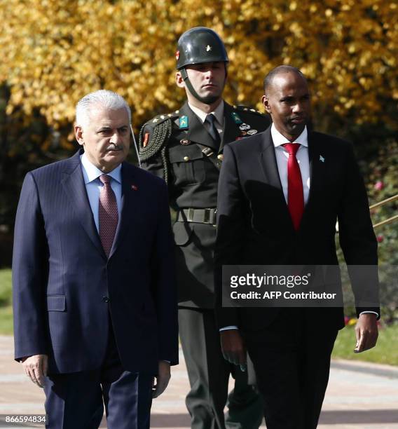 Turkish Prime Minister Binali Yildirim welcomes Somalian Prime Minister Hassan Ali Khayre during a welcoming ceremony at the Cankaya Palace in...