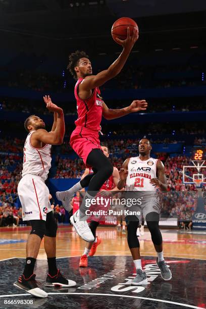 Jean-Pierre Tokoto of the Wildcats lays up during the round four NBL match between the Perth Wildcats and the Illawarra Hawks at Perth Arena on...