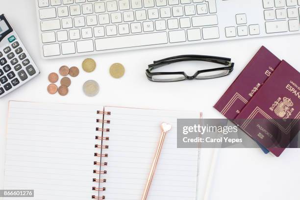 top view notebook, pencil, calculator and coins, passport.travel concept - passport page stock pictures, royalty-free photos & images