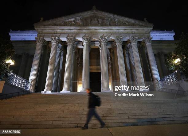 Man walks past the United States National Archives building on October 26, 2017 in Washington, DC. Later today the National Archives will release...