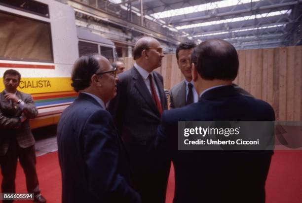 Bettino Craxi, Fedele Confalonieri, Bobo Craxi and Silvio Berlusconi talking at the Convention of the Italian Socialist Party on the 5th of April...