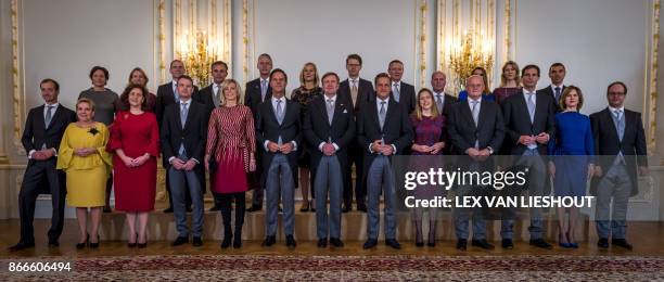 The new Dutch cabinet poses with Dutch King Willem-Alexander for a traditional photo Minister of Economic Affairs and Climate Eric Wiebes, Minister...