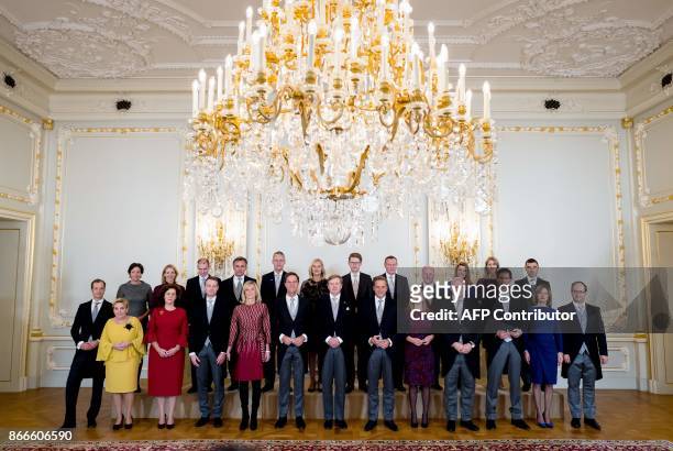 The new Dutch cabinet poses with Dutch King Willem-Alexander for a traditional photo Minister of Economic Affairs and Climate Eric Wiebes, Minister...