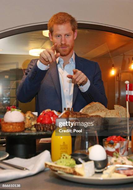 Prince Harry meets people involved in the One of Us campaign, which aims to raise awareness of mental health, at a bakery in Hellerup, Copenhagen,...