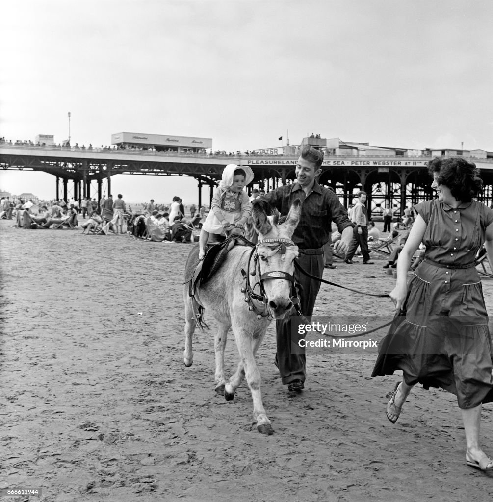 Donkey Rimi A young holiday makers having a Donkey ride on the beach at... News ...