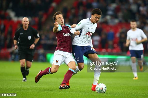 West Ham United's Mark Noble tackles Tottenham Hotspur's Dele Alli during Carabao Cup 4th Round match between Tottenham Hotspur and West Ham United...