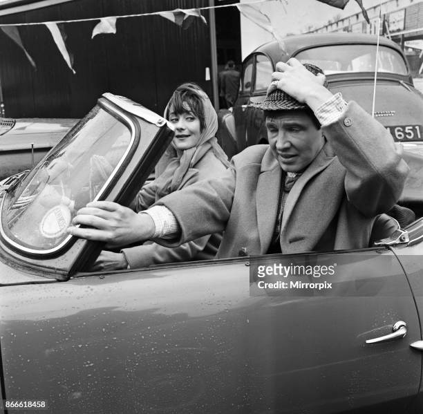 Scene for a future 'Coronation Street' episode calls for Dennis Tanner to go to a motor race meeting. He is driven there by Amanda Reiss. The scene...