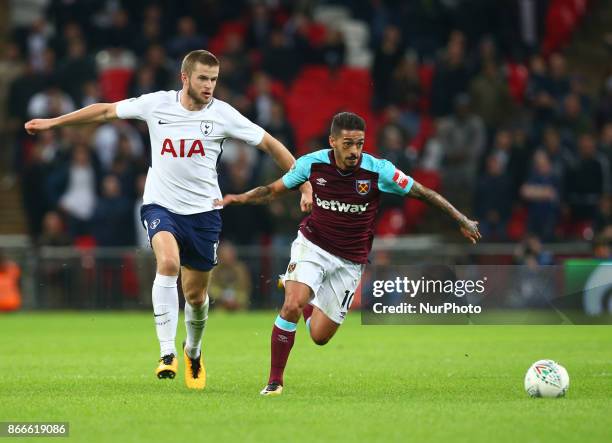 West Ham United's Manuel Lanzini holds of Tottenham Hotspur's Eric Dier during Carabao Cup 4th Round match between Tottenham Hotspur and West Ham...