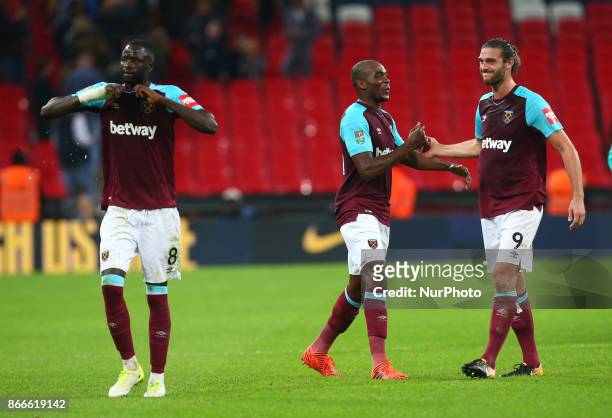 West Ham United's Andre Ayew and West Ham United's Andy Carroll celebratee they win during Carabao Cup 4th Round match between Tottenham Hotspur and...