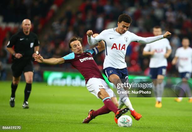 West Ham United's Mark Noble tackles Tottenham Hotspur's Dele Alli during Carabao Cup 4th Round match between Tottenham Hotspur and West Ham United...