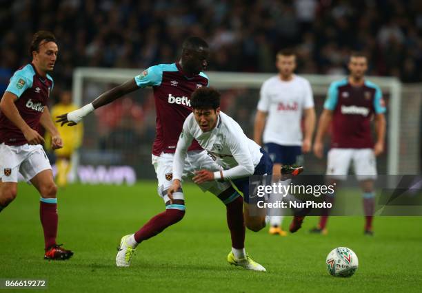 Tottenham Hotspur's Son Heung-Min gets browght down by West Ham United's Cheikhou Kouyate during Carabao Cup 4th Round match between Tottenham...