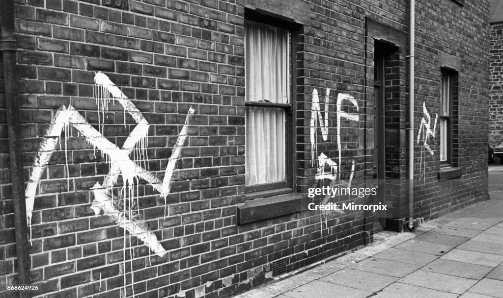 Graphidy Signs Graffiti Swastikas and National Front signs painted on houses and a ...
