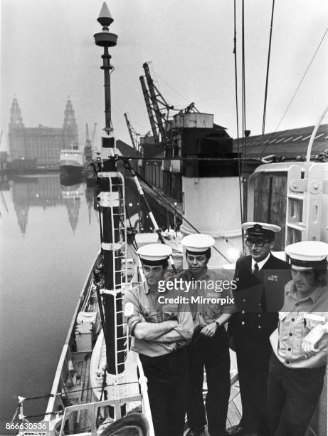 Sailors and Naval officer on board minesweeper HMS Mersey, based at the training centre for the Royal Naval Reserve HMS Eaglet. In the background is...