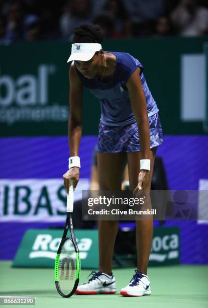 Venus Williams of the United States reacts in her singles match against Garbine Muguruza of Spain during day 5 of the BNP Paribas WTA Finals...