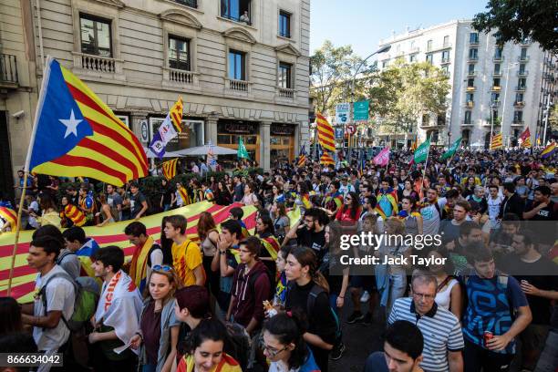 Protesters march during a Catalan pro-independence strike of university students on October 26, 2017 in Barcelona, Spain. The Parliament of Catalonia...