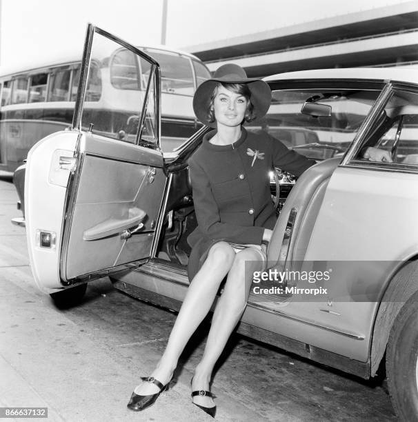 Top model Jean Shrimpton was on the move again when she flew off to New York from Heathrow Airport. Jean wore a navy suit and a large picture hat,...