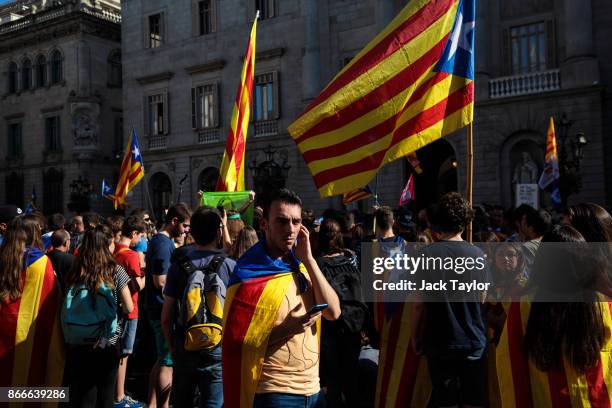 Protesters gather with Catalan pro-independence flags outside the Barcelona town hall during a strike of university students on October 26, 2017 in...