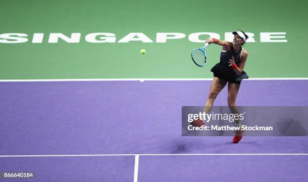 Garbine Muguruza of Spain smashes in her singles match against Venus Williams of the United States during day 5 of the BNP Paribas WTA Finals...