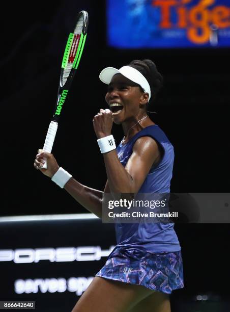Venus Williams of the United States celebrates victory in her singles match against Garbine Muguruza of Spain during day 5 of the BNP Paribas WTA...