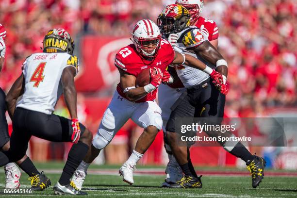 Wisconsin Badger running back Jonathan Taylor makes a cut to the open field on Maryland Terrapins defensive back Darnell Savage, Jr. Durning an...