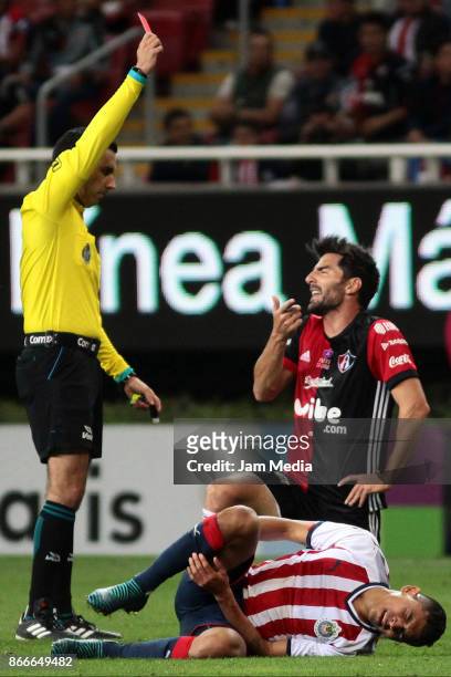 Referee Cesar Ramos shows a red card to Facundo Erpen of Atlas after a foul over Orbelin Pineda of Chivas during the round of sixteen match between...