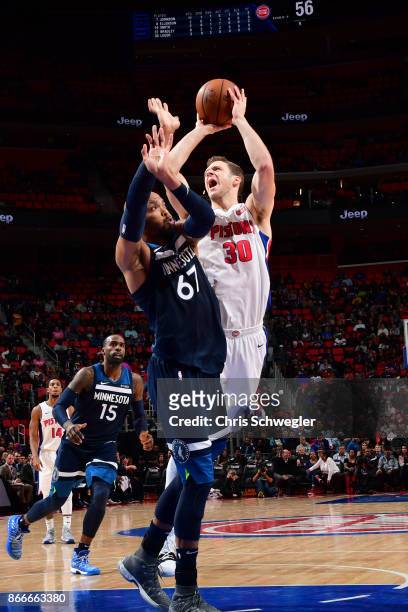 Jon Leuer of the Detroit Pistons shoots the ball against the Minnesota Timberwolves on October 25, 2017 at Little Caesars Arena in Detroit, Michigan....