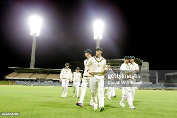 George Bailey of the Tigers leads the team off at trhe end of play on day one of the Sheffield Shield match between Western Australia and Tasmania at...